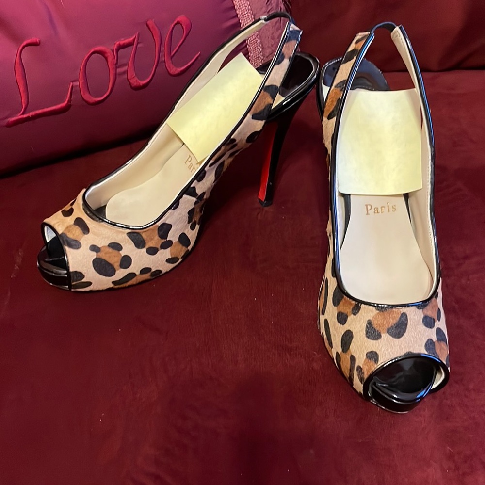 Sling back heels. Animal print. NOT “red bottoms” 😉